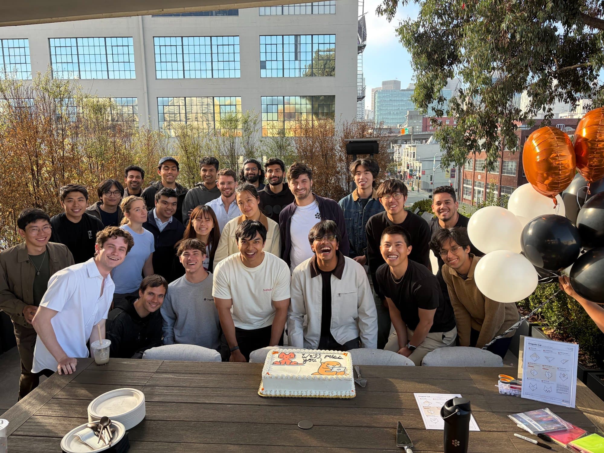 The Cognition team gathered around a cake at Mokshit’s going-away party