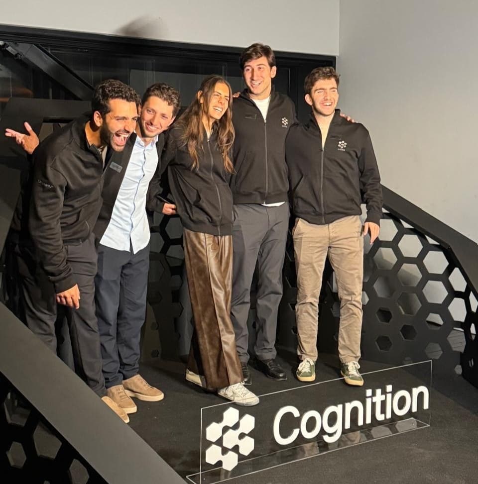 Daniella and teammates on stage at the Cognition Champions Summit