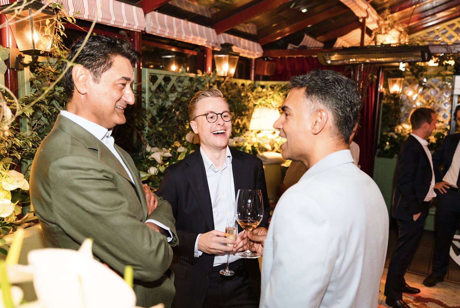 Guests talking at the opening of Cognition’s new London office at The Gilbert